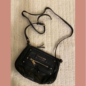 Michael Kors, black leather crossbody bag with gold accents
